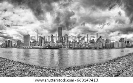 Black and white Manhattan panorama seen from Roosevelt Island, New York City, USA.