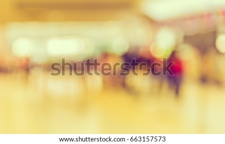 Blur image of people and walkway in airport for background usage . (vintage tone)