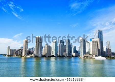 Miami skyscrapers with blue cloudy sky,yacht or boat next to Miami downtown, Aerial view, south beach