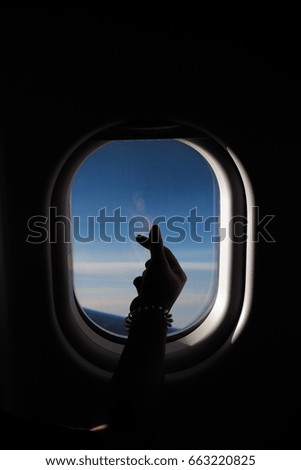 Airplane window with love sign