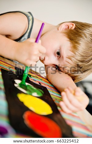 Kid playing and drawing traffic light