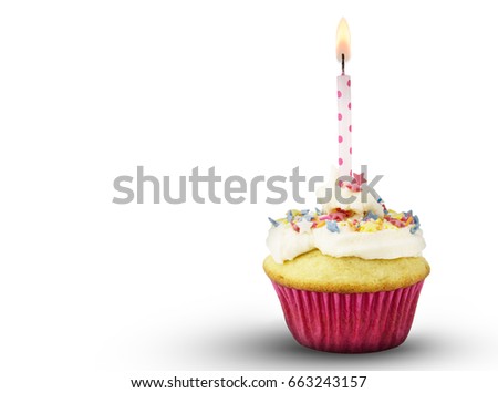 Single cup cake with lit pink spotted candle isolated on white background
