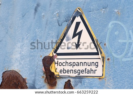 Warning of high voltage in German