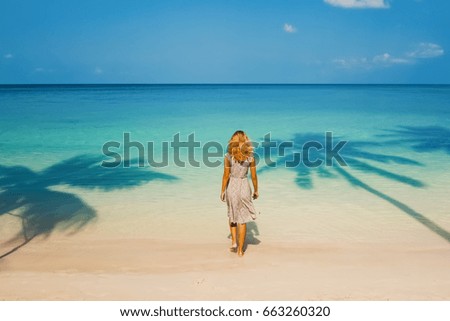 A girl on a paradise beach.