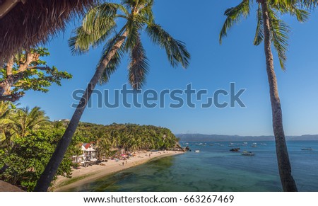 Natural background from Boracay island with coconut palms tree leafs, blue sky and white beach Travel Vacation