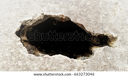 Stone grunge odd wall with hole. Abstract strange background Royalty-Free Stock Photo #663273046