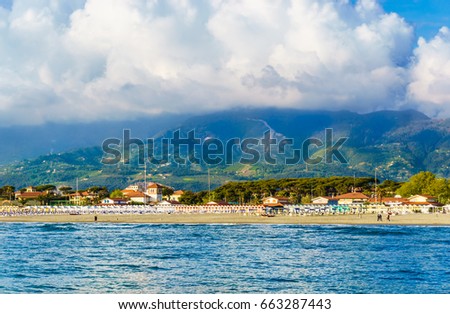Panoramic view Versilia coast Forte dei Marmi city with riviera resorts and Apuan Alps in background, Versilia, Tuscany, Italy. Royalty-Free Stock Photo #663287443