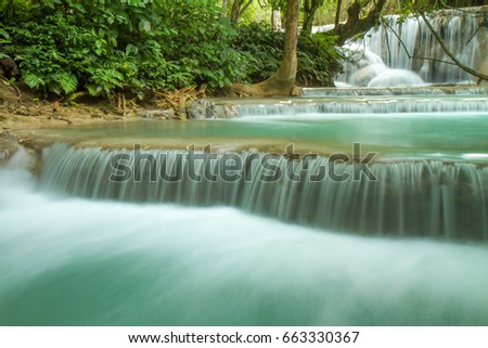 Waterfall in rain forest (Tat Kuang Si Waterfalls at Luang prabang, Laos.)