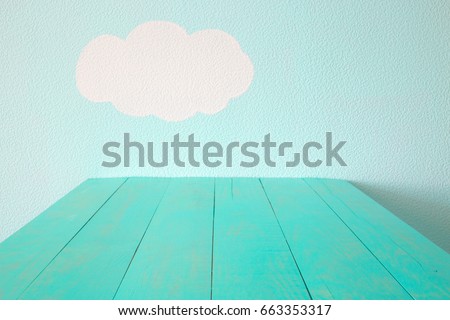 turquoise empty table and blue wall.
