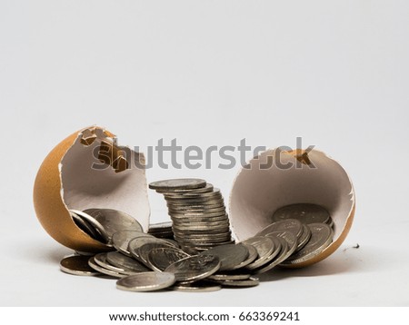 Money with egg in white background, this picture for finance concept