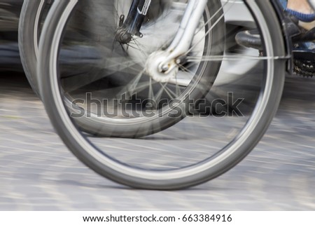 Quickly spinning bicycle wheels on the road