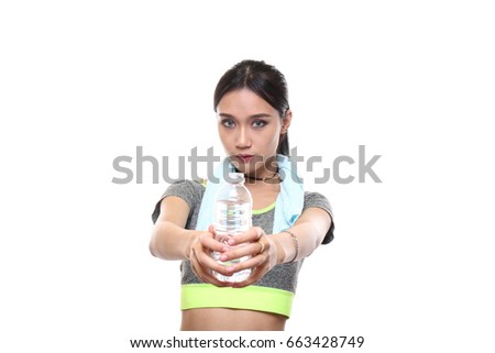 Charming tan skin Asian woman with exercise suit hand hold pure water bottle isolated on white background, Presenting fitness and good healthy concept. 