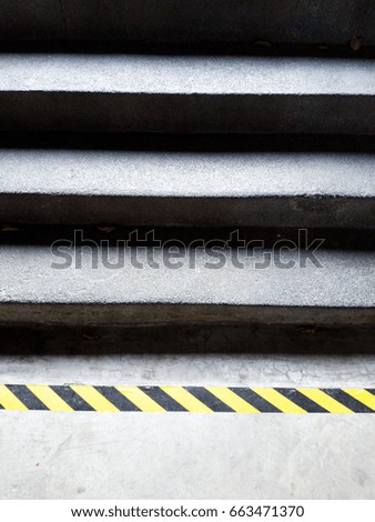 concrete staircase with warning line, safety concept 