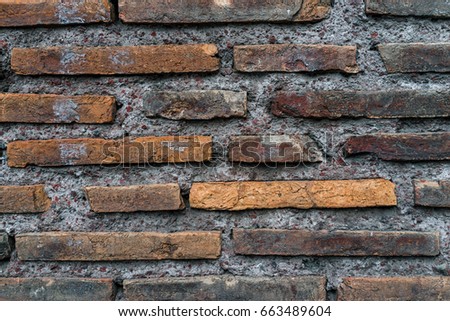 closed up of grunge aged brick wall texture as background.