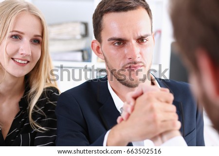 Woman and man in suit hold hands in wrestle. Strong people battle portrait, female emancipation, feminism war, white collar rival game, aggressive expression, agreement effort, arbitration concept