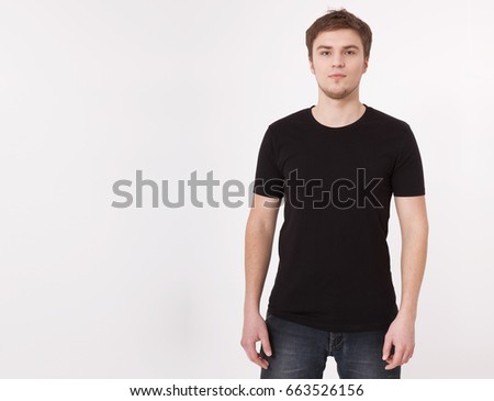 Young man wearing blank t-shirt isolated on white background. Copy space. Place for advertisement. Front view.