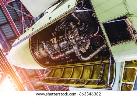 View of aircraft tail and auxiliary power unit Royalty-Free Stock Photo #663546382