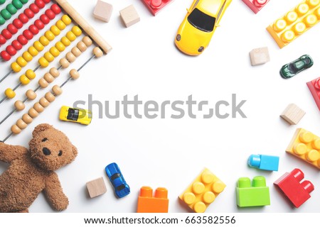 Kids toys frame on white background. Top view. Flat lay. Copy space for text Royalty-Free Stock Photo #663582556