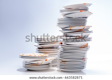 Dirty dishes isolated on White Royalty-Free Stock Photo #663582871