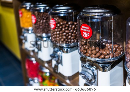 Chocolate covered almonds in French coin dispenser candy machines