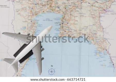 Airplane Model at Bottom Left Corner on Map Background. Copy Space for Text. 