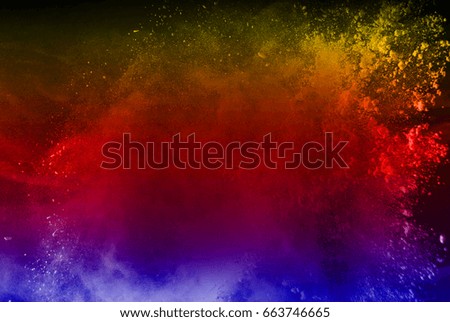 abstract powder splatted background,Freeze motion of color powder exploding/throwing color powder,color glitter texture on black background  