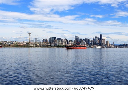 View of the city by the sea.
Cargo in Seattle skyline.