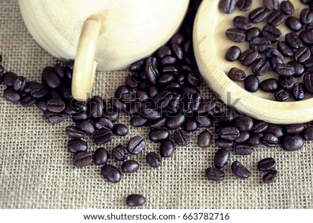 Coffee bean in wooden cup closeup top view angle background