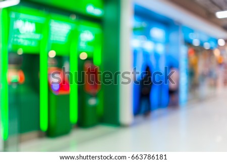 Blurred of ATM machine green in Department store. for background usage.