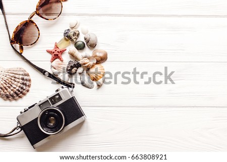 camera shells sunglasses on white background with space for text, summer vacation concept, top view. summertime holiday picture, wanderlust and travel. flat lay