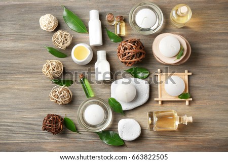 Spa composition with tea tree oil on wooden background