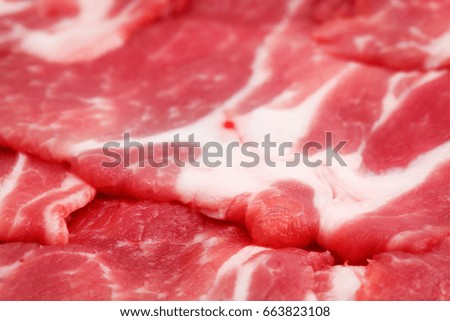Close-up of sliced raw red meat (pork)