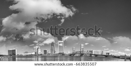 Black and white panoramic view of Jacksonville skyline along the river - Florida.