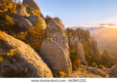 Beautiful autumn mountain landscape at  sunshine day with. Autumn yellow forest  and trees with the top of the mountains. Crimea, Russia