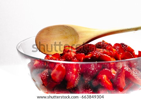 Sliced strawberries in glass dish. Natural food ingredients