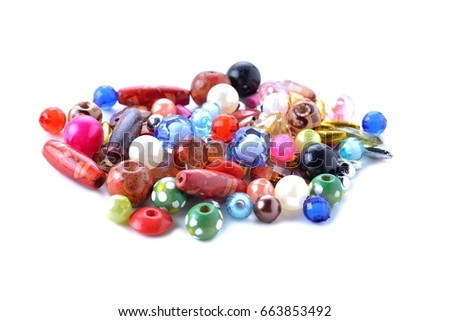 Mixture of Glass decoration attributes in divers colors and arrangements, Many colorful glass beads isolated on white background