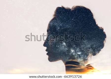 Dreamer with stars inside her head Royalty-Free Stock Photo #663913726