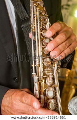 saxophone player jazz orchestra music