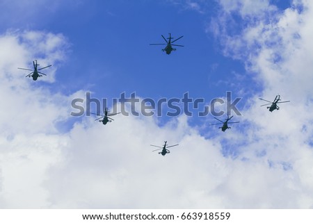 Group of military helicopters in the sky