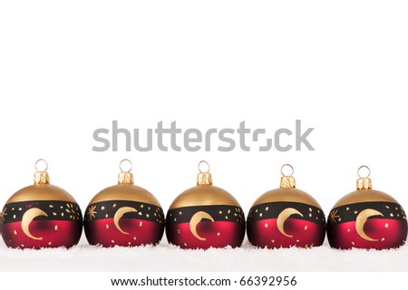 christmas baubles in the snow isolated on white