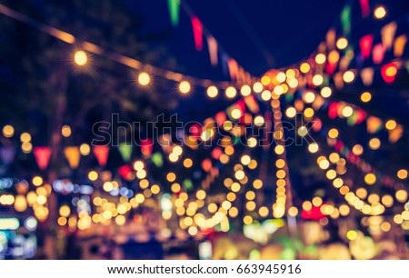 abstract blur image of night market festival for background usage . (vintage tone) Royalty-Free Stock Photo #663945916