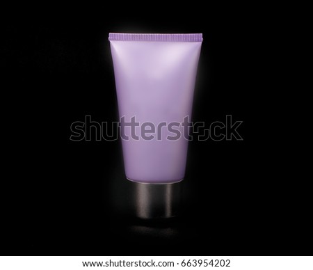 Tube for cream on a black background