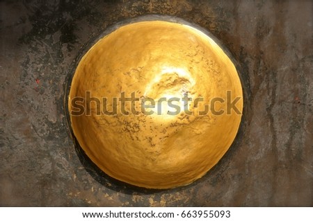 Golden hemisphere on a mottled background