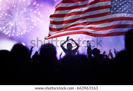 Crowd of people celebrating Independence Day. United States of America USA flag with fireworks background for 4th of July