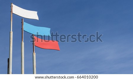 The stylized flag of Russia against the blue sky