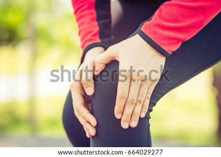 runner woman accident knee pain during marathon running Royalty-Free Stock Photo #664029277