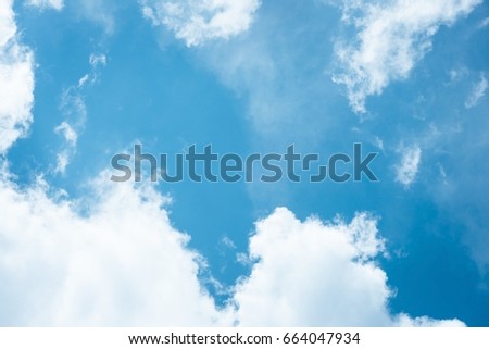 Cumulus humilis clouds in the blue sky, view from below Royalty-Free Stock Photo #664047934