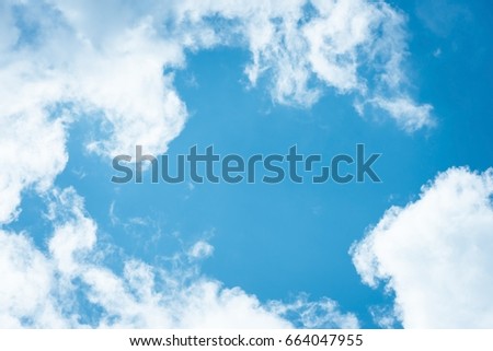 Cumulus humilis clouds in the blue sky, view from below Royalty-Free Stock Photo #664047955