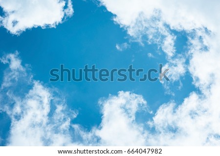Cumulus humilis clouds in the blue sky, view from below Royalty-Free Stock Photo #664047982