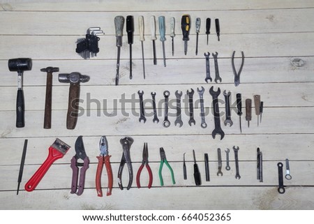 construction hammers screwdriver repair tool pliers on the boards